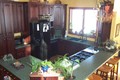 Gourmet Kitchen With Cherry Cabinets and Breakfast Bar
